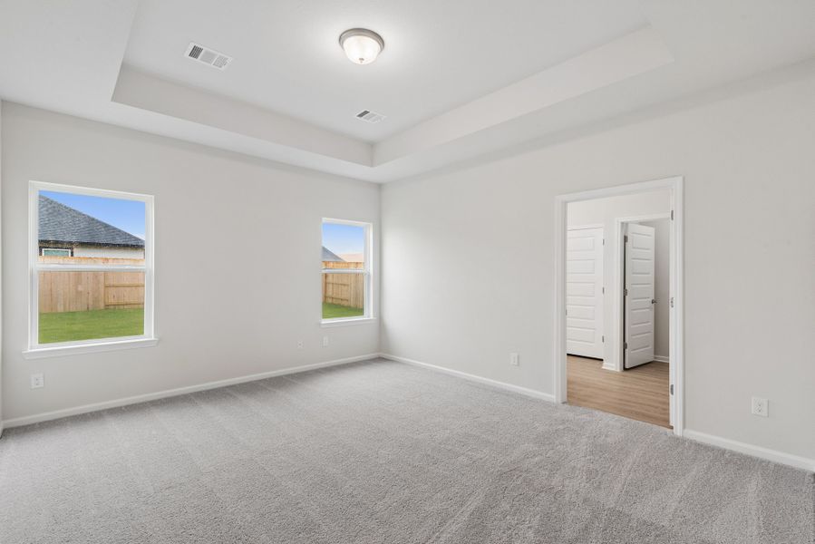 The Oakshire II- Primary Bedroom with Tray Ceiling.  Sample image for illustration; upgrades, options, and colors may vary.