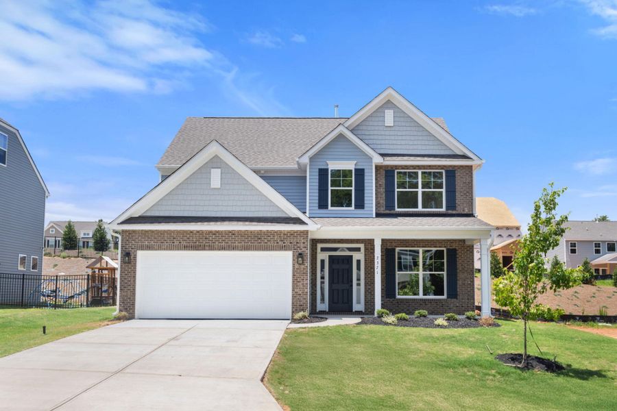 Front exterior of a new home in Pisgah Park, Kernersville, NC, highlighting curb appeal (Image 1). Front exterior of a new home in Pisgah Park, Kernersville, NC, highlighting curb appeal (Image 1).