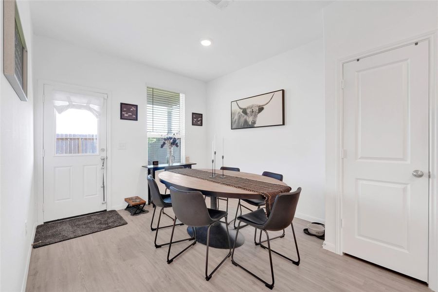 The dining space blends sophistication and warmth, offering an ideal setting for family meals or gatherings with friends—thoughtfully positioned to connect effortlessly with the kitchen and living room.