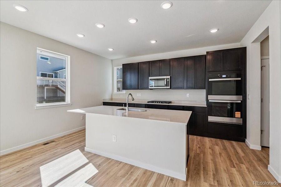 Furnished interior view inside a new home in Floret Collection at Alder Creek, Parker (Image 7).