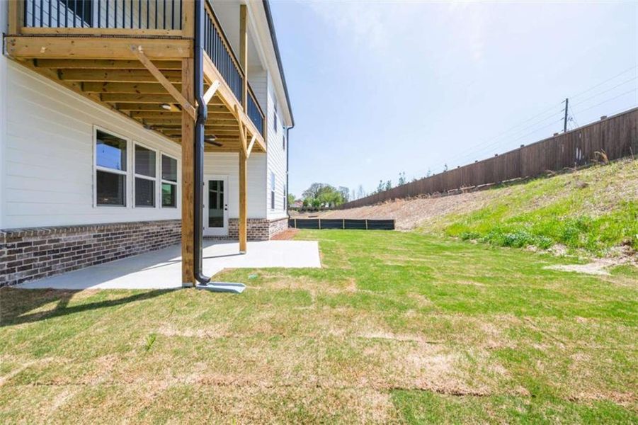 Exterior details and patio area of a home in The Paddocks at Doc Hughes, Buford (Image 2). Exterior details and patio area of a home in The Paddocks at Doc Hughes, Buford (Image 2).
