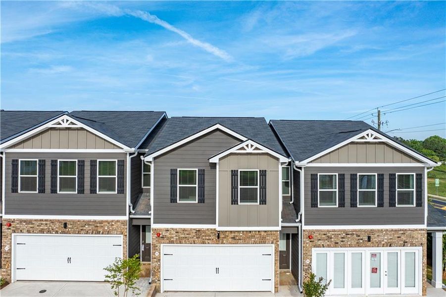 Front exterior of a new home in , Hampton, GA, highlighting curb appeal (Image 1). Front exterior of a new home in , Hampton, GA, highlighting curb appeal (Image 1).