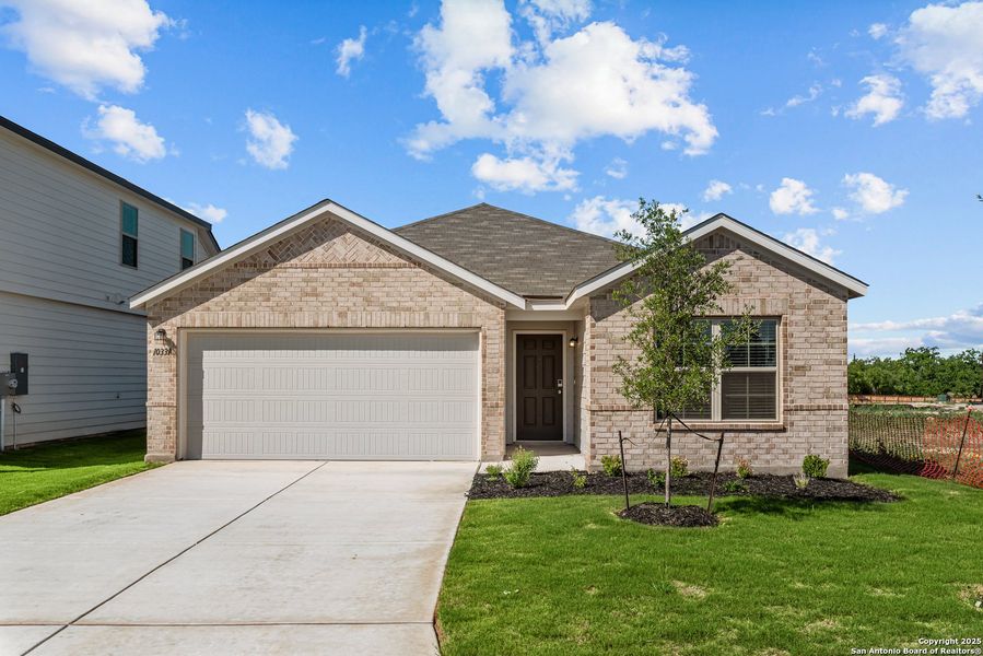 Front exterior of a new home in Blue Ridge Ranch, San Antonio, TX, highlighting curb appeal (Image 1). Front exterior of a new home in Blue Ridge Ranch, San Antonio, TX, highlighting curb appeal (Image 1).