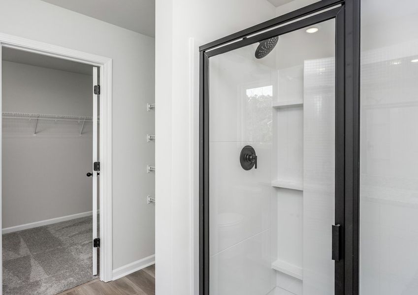 The master bathroom features a glass-enclosed shower. The master bathroom features a glass-enclosed shower.