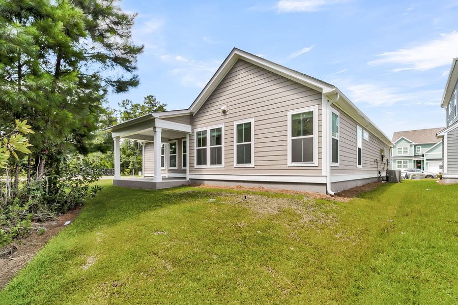 Exterior details and patio area of a home in Tidewater at Lakes of Cane Bay, Summerville (Image 2).