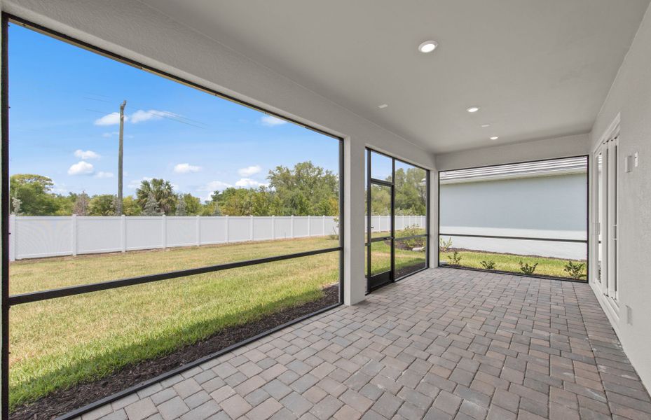 Exterior details and patio area of a home in Shores at Stillwater, Englewood (Image 3).