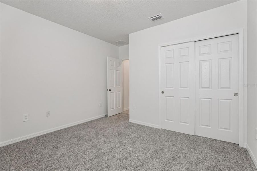 Spacious, unfurnished interior of a new home in Bradbury Creek - Signature Series, Haines City (Image 22).