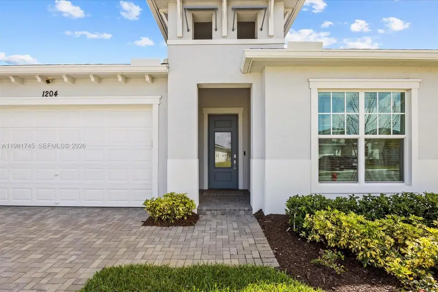 Exterior details and patio area of a home in Veranda Preserve, Port St. Lucie (Image 3).