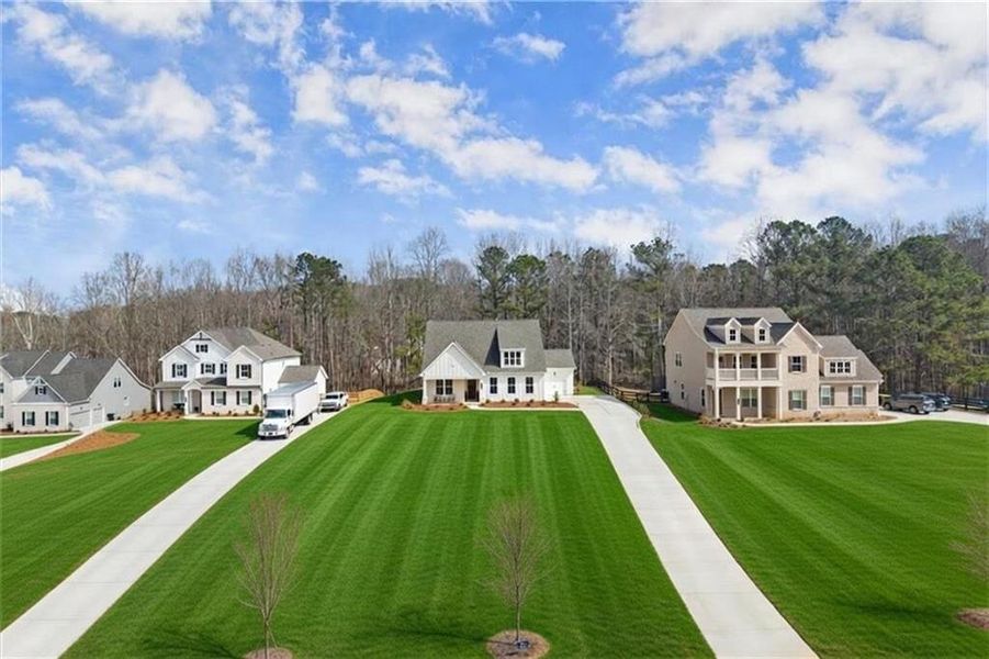 Front exterior of a new home in Prescott Manor, Canton, GA, highlighting curb appeal (Image 27).