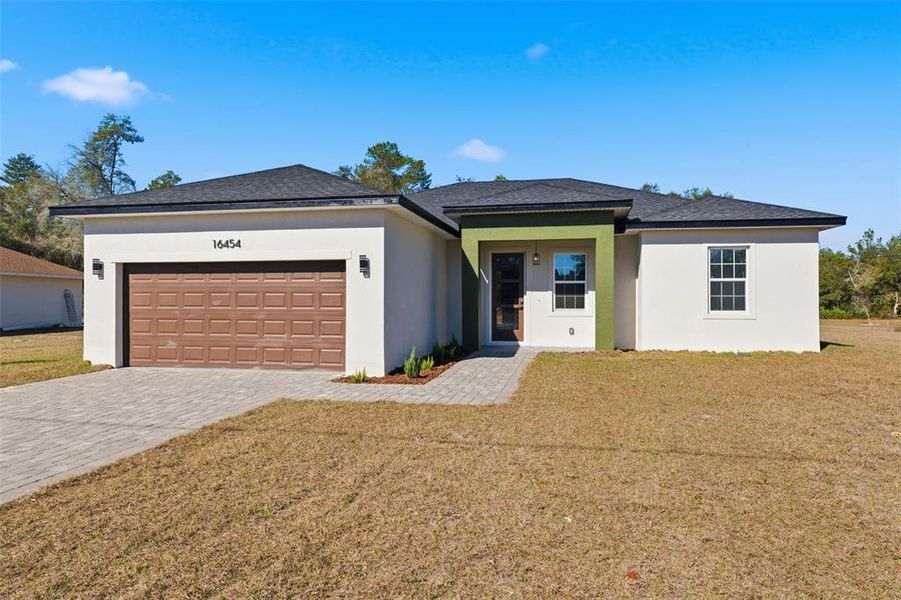 Front exterior of a new home in , Ocala, FL, highlighting curb appeal (Image 18).
