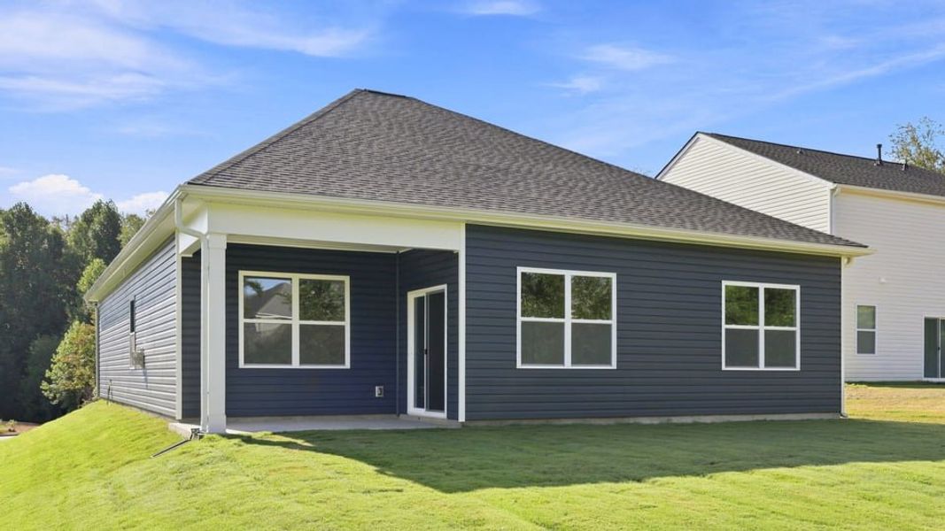 Exterior details and patio area of a home in Durbin Meadows Traditions, Fountain Inn (Image 4).