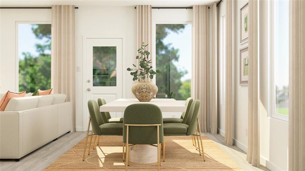 Dining room featuring a wealth of natural light and light wood-type flooring