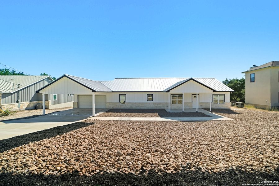 Exterior details and patio area of a home in , Lakehills (Image 4).