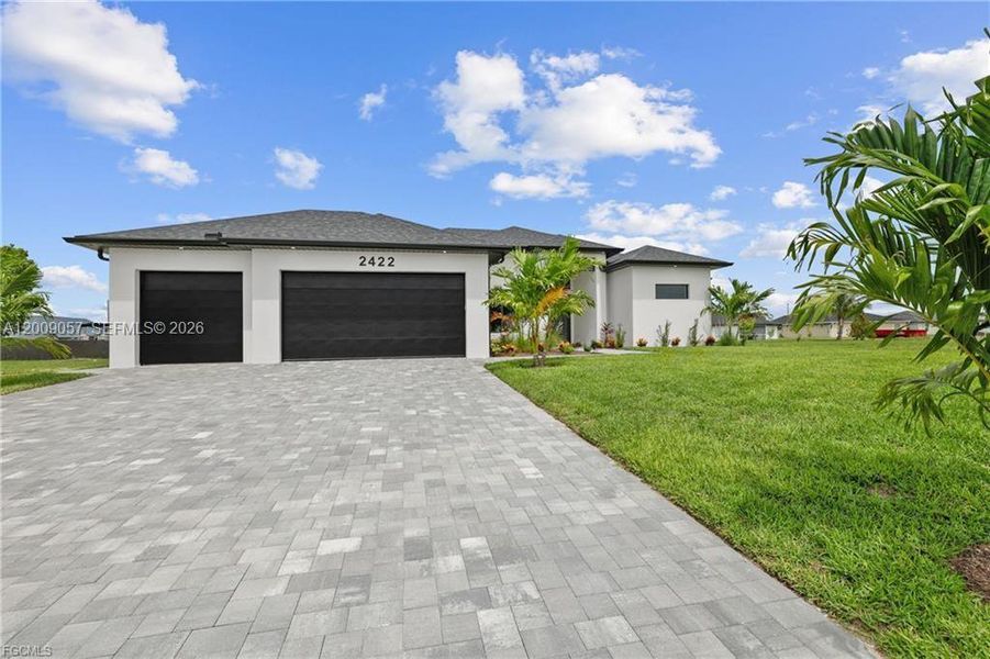 Front exterior of a new home in , Cape Coral, FL, highlighting curb appeal (Image 28).