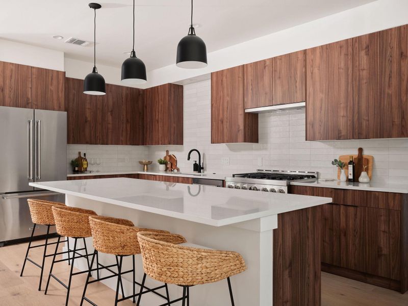 Kitchen with backsplash, modern cabinets, a center island, and stainless steel appliances Kitchen with backsplash, modern cabinets, a center island, and stainless steel appliances