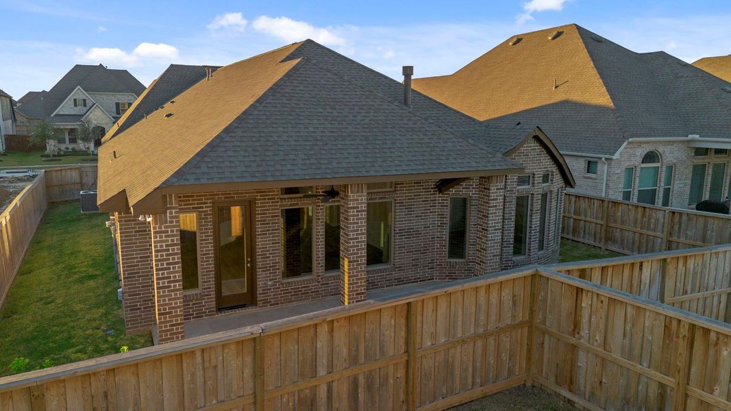 Exterior details and patio area of a home in Dunham Pointe, Cypress (Image 23).