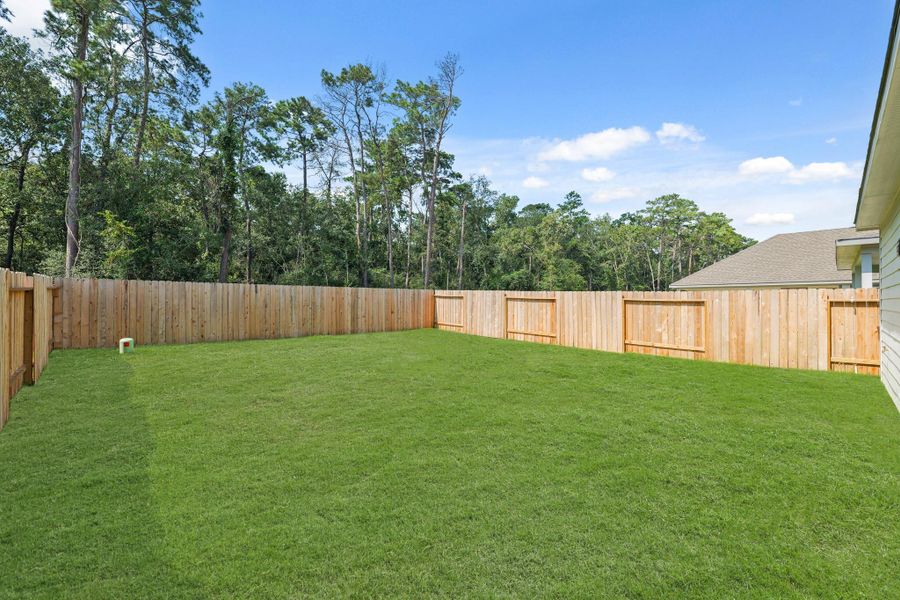 Exterior details and patio area of a home in Cypresswood Landing, Humble (Image 19).