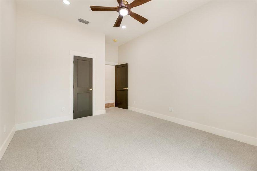 Unfurnished bedroom with carpet floors, ceiling fan, and recessed lighting
