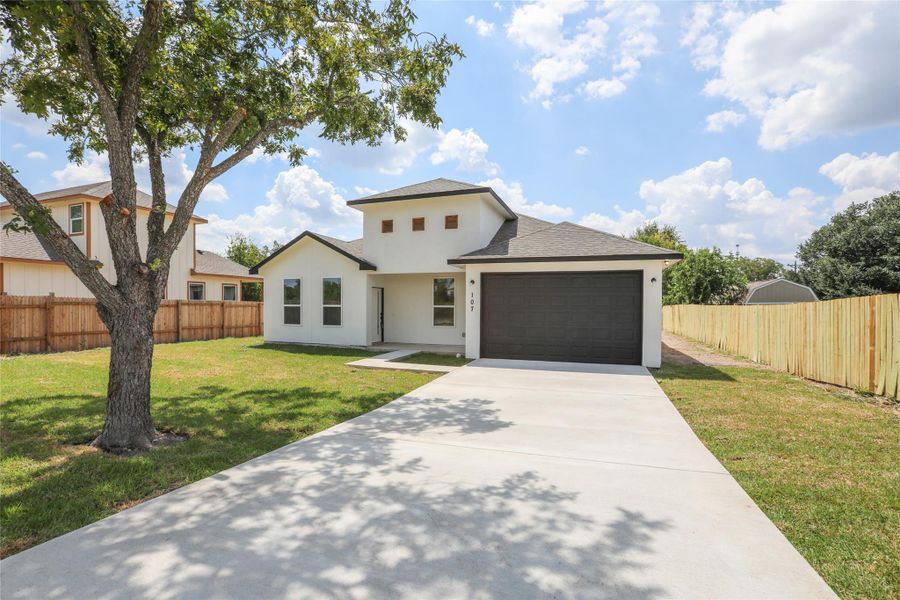 Front exterior of a new home in , Bastrop, TX, highlighting curb appeal (Image 20). Front exterior of a new home in , Bastrop, TX, highlighting curb appeal (Image 20).