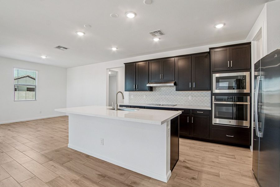 Gourmet kitchen option and dining. Finishes and options may vary by community