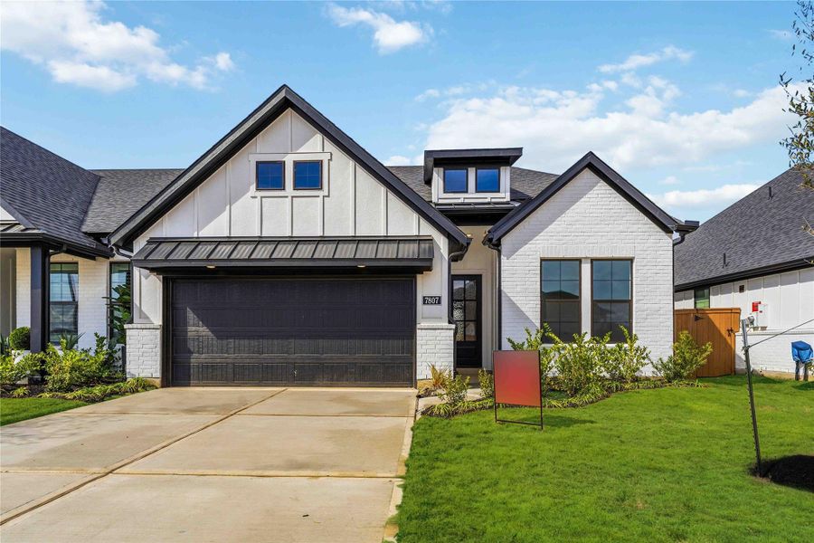 Front exterior of a new home in Elyson, Katy, TX, highlighting curb appeal (Image 2). Front exterior of a new home in Elyson, Katy, TX, highlighting curb appeal (Image 2).