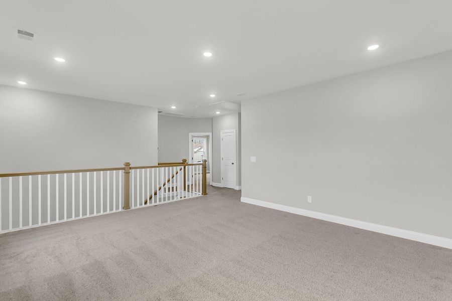 Spacious, unfurnished interior of a new home in Tidewater at Lakes of Cane Bay, Summerville (Image 25).