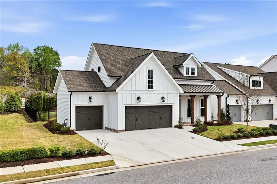 Front exterior of a new home in , Canton, GA, highlighting curb appeal (Image 1). Front exterior of a new home in , Canton, GA, highlighting curb appeal (Image 1).