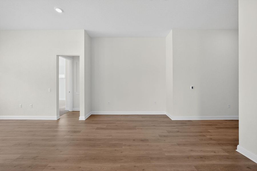 Unfurnished room with light wood-type flooring and recessed lighting Unfurnished room with light wood-type flooring and recessed lighting