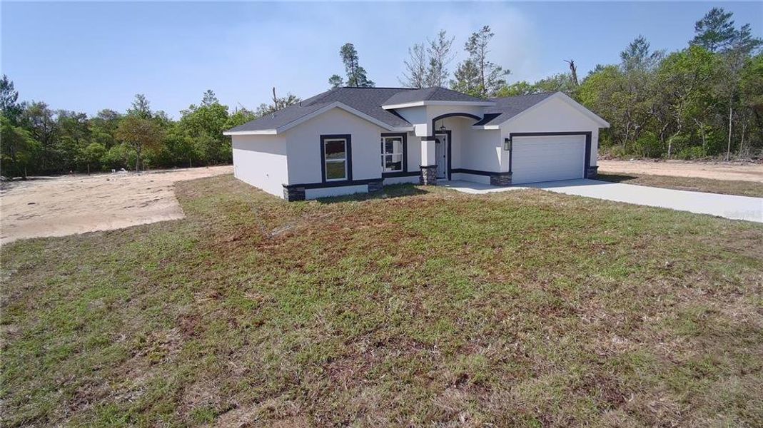 Front exterior of a new home in , Ocala, FL, highlighting curb appeal (Image 2). Front exterior of a new home in , Ocala, FL, highlighting curb appeal (Image 2).
