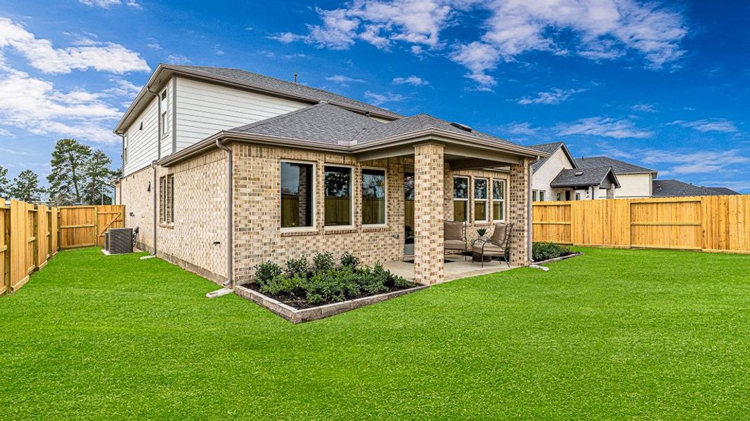 Exterior details and patio area of a home in Raburn Reserve 50s, Tomball (Image 19).