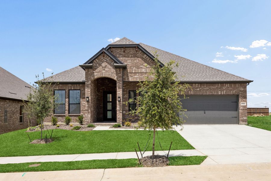 Front exterior of a new home in Country Lakes, Denton, TX, highlighting curb appeal (Image 1). Front exterior of a new home in Country Lakes, Denton, TX, highlighting curb appeal (Image 1).