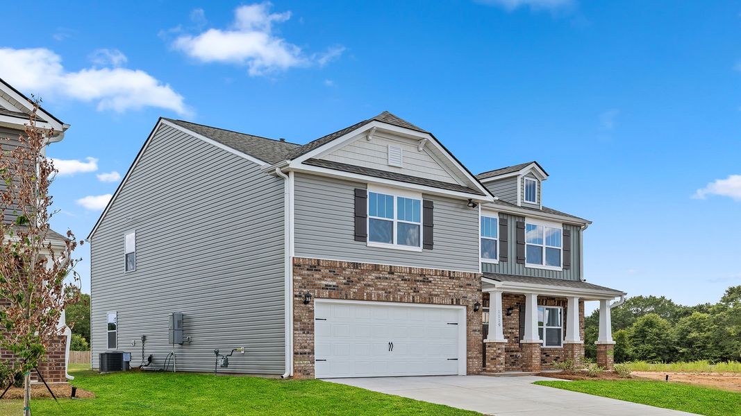 Front exterior of a new home in Chestnut Ridge, Greenville, SC, highlighting curb appeal (Image 2). Front exterior of a new home in Chestnut Ridge, Greenville, SC, highlighting curb appeal (Image 2).