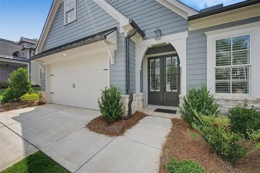 Exterior details and patio area of a home in Lakeside at River Green, Canton (Image 26).