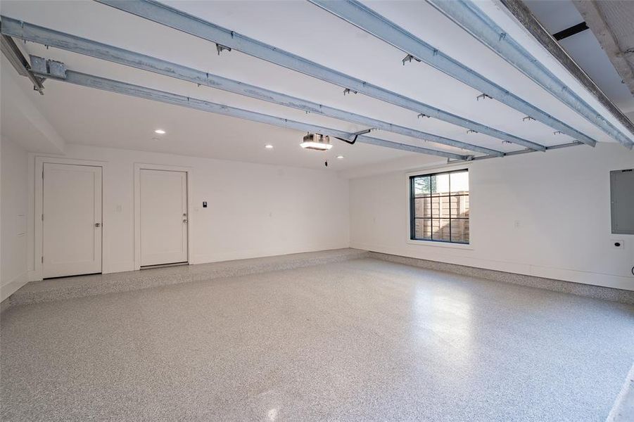 Private 2 car garage with epoxy flooring and electric car charging outlet