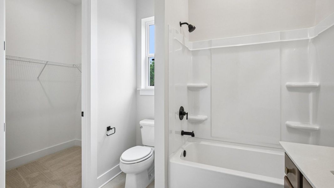 Bathroom with access to closet Bathroom with access to closet