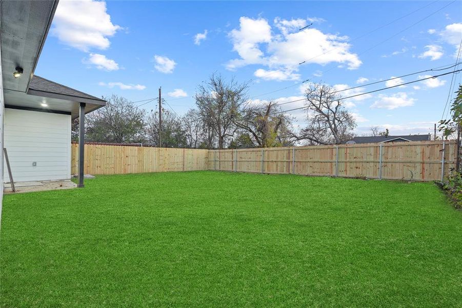 View of fenced backyard