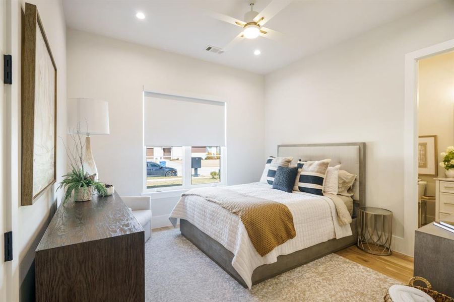 Bedroom featuring ceiling fan and light hardwood / wood-style floors