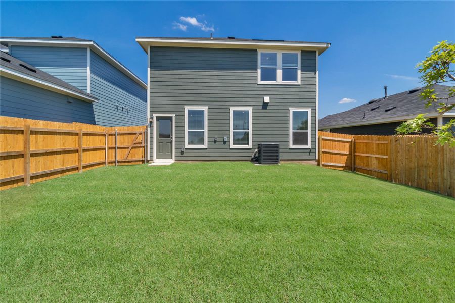 Front exterior of a new home in Marigold, Uhland, TX, highlighting curb appeal (Image 16).