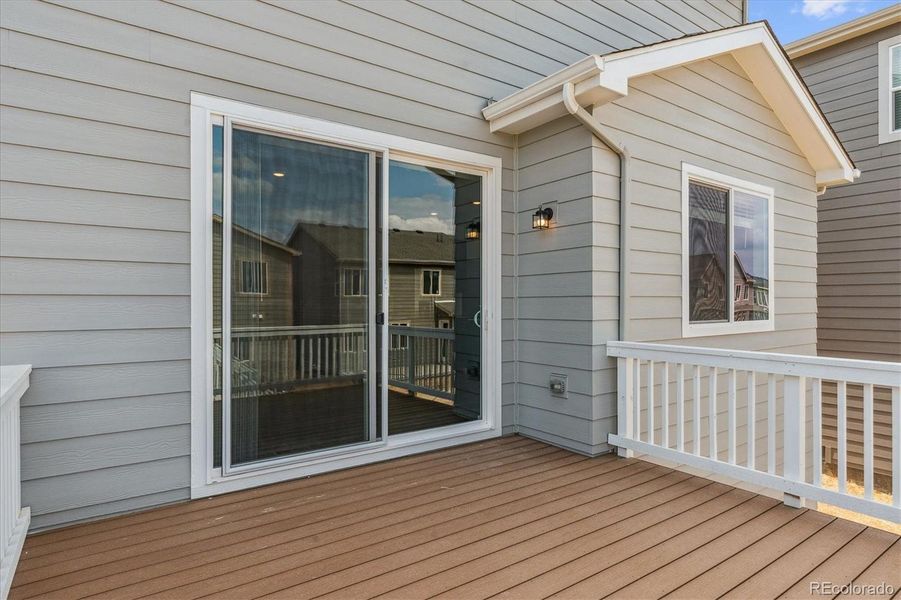 Front exterior of a new home in Floret Collection at Alder Creek, Parker, CO, highlighting curb appeal (Image 1).