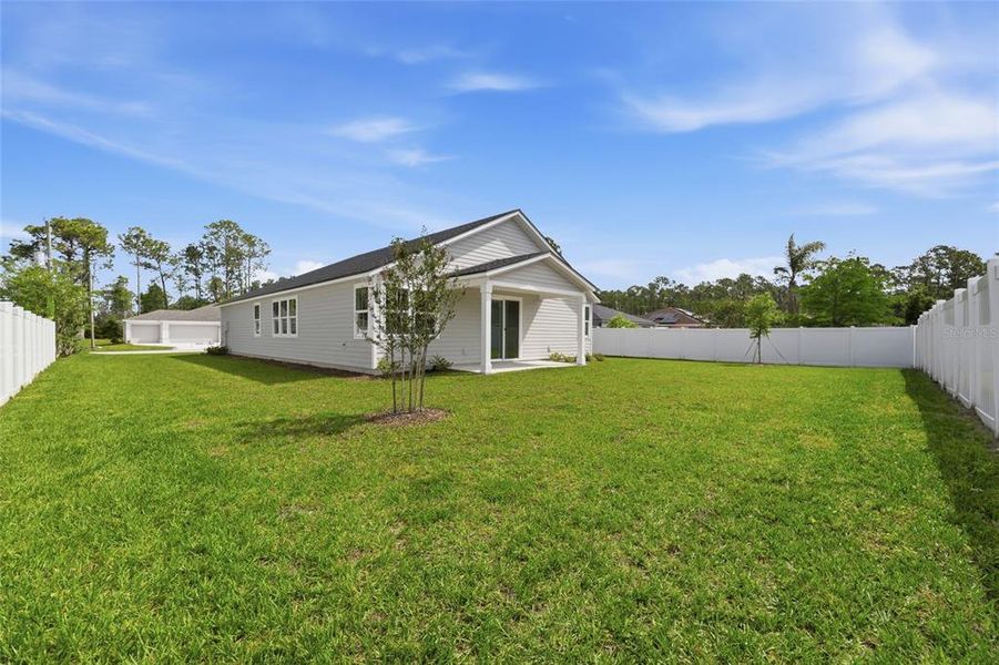 Exterior details and patio area of a home in Palm Coast Homes, Palm Coast (Image 4).