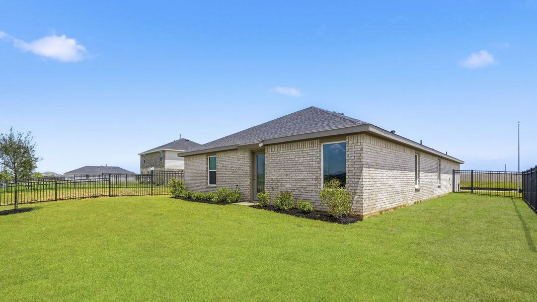 Exterior details and patio area of a home in Sunterra, Katy (Image 3).