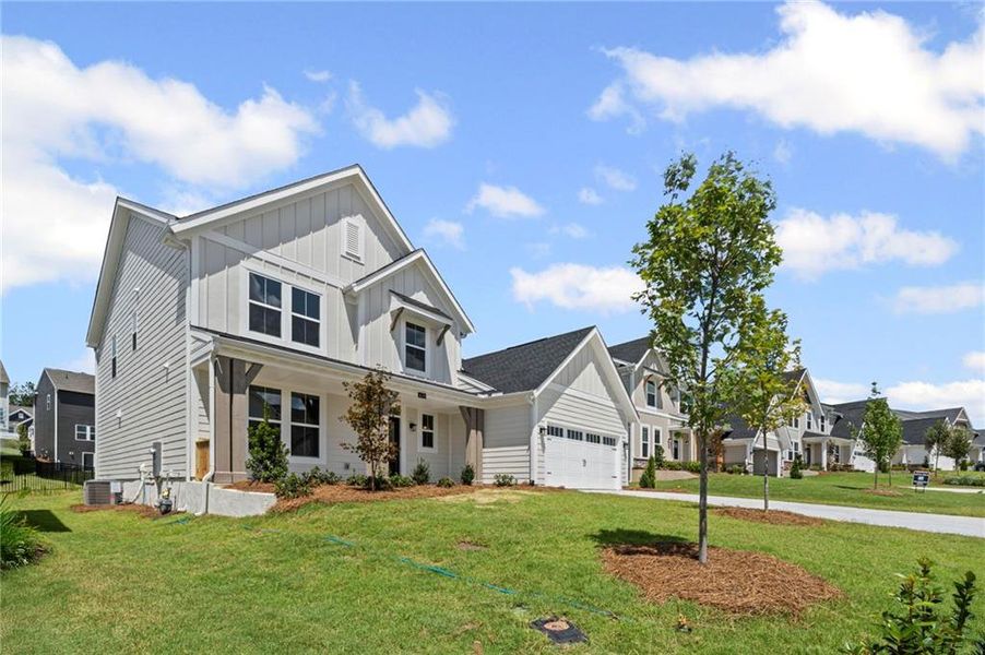 Front exterior of a new home in Twin Lakes, Hoschton, GA, highlighting curb appeal (Image 26).