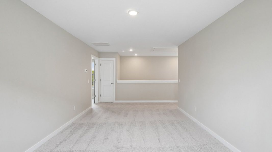 Second Floor Loft area with view of stairs and carpet Second Floor Loft area with view of stairs and carpet