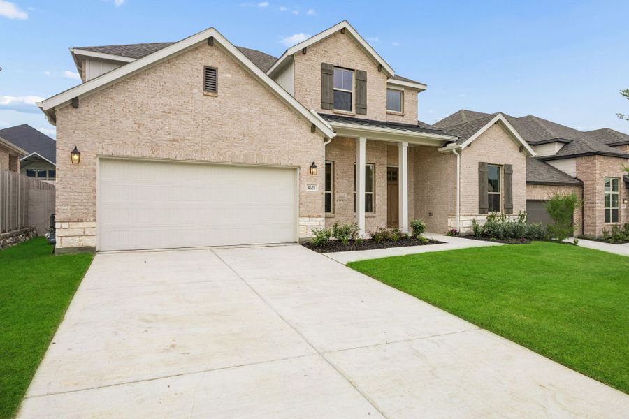 Front exterior of a new home in Painted Tree Lakeside, McKinney, TX, highlighting curb appeal (Image 2). Front exterior of a new home in Painted Tree Lakeside, McKinney, TX, highlighting curb appeal (Image 2).