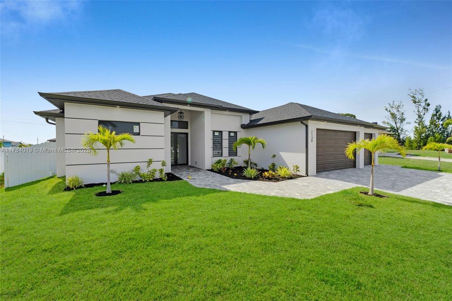 Front exterior of a new home in , Cape Coral, FL, highlighting curb appeal (Image 25).