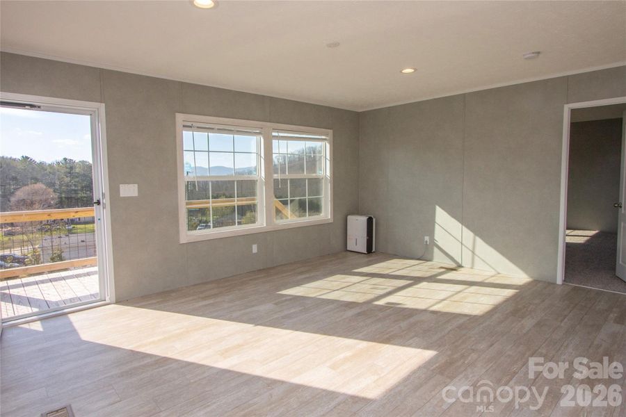 Living Room w/ Mountain Views toward Primary BR