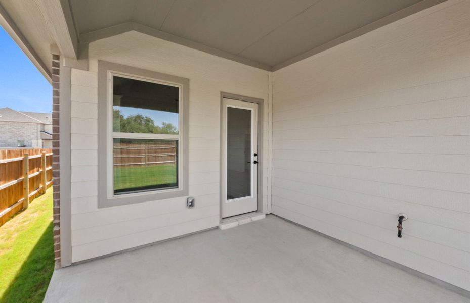 Exterior details and patio area of a home in Saddleback at Santa Rita Ranch, Liberty Hill (Image 25). Exterior details and patio area of a home in Saddleback at Santa Rita Ranch, Liberty Hill (Image 25).