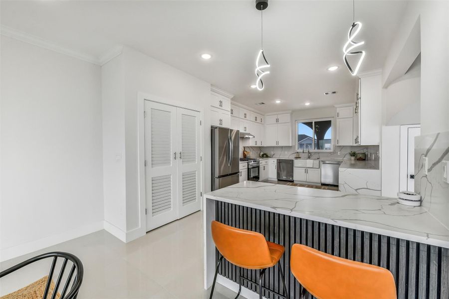 Casual luxury lives at the center island. Pull up a seat for conversation while generous counters keep preparation and serving beautifully organized. Casual luxury lives at the center island. Pull up a seat for conversation while generous counters keep preparation and serving beautifully organized.