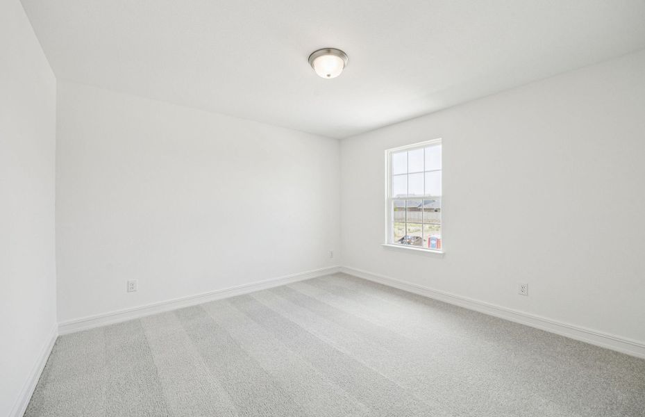 Secondary bedroom designed for comfort and convenience  *Real home pictured