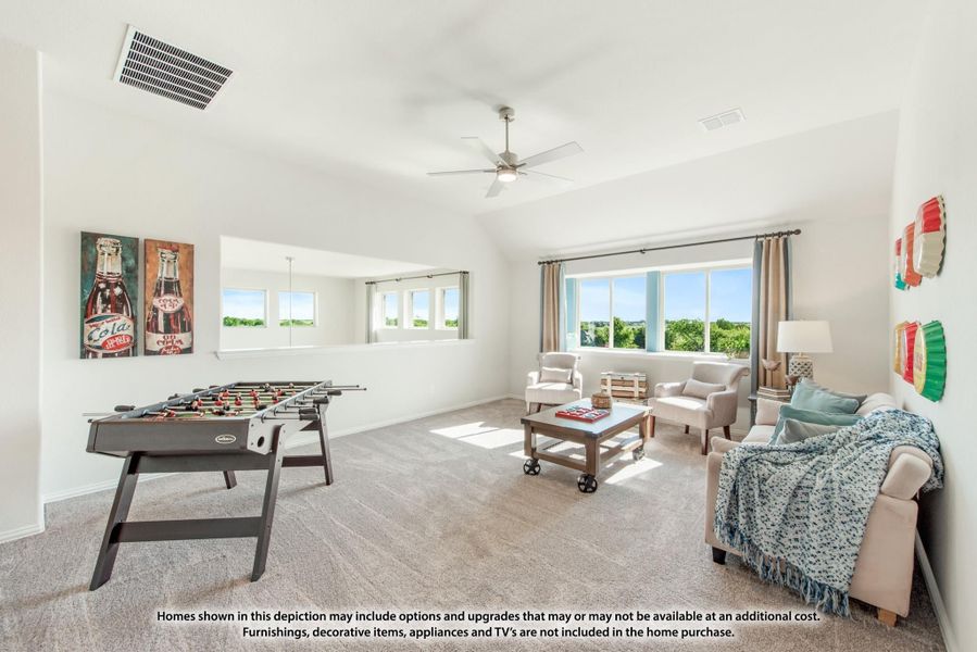 Bonus room with foosball table, seating area, ceiling fan, and large windows with outdoor views
